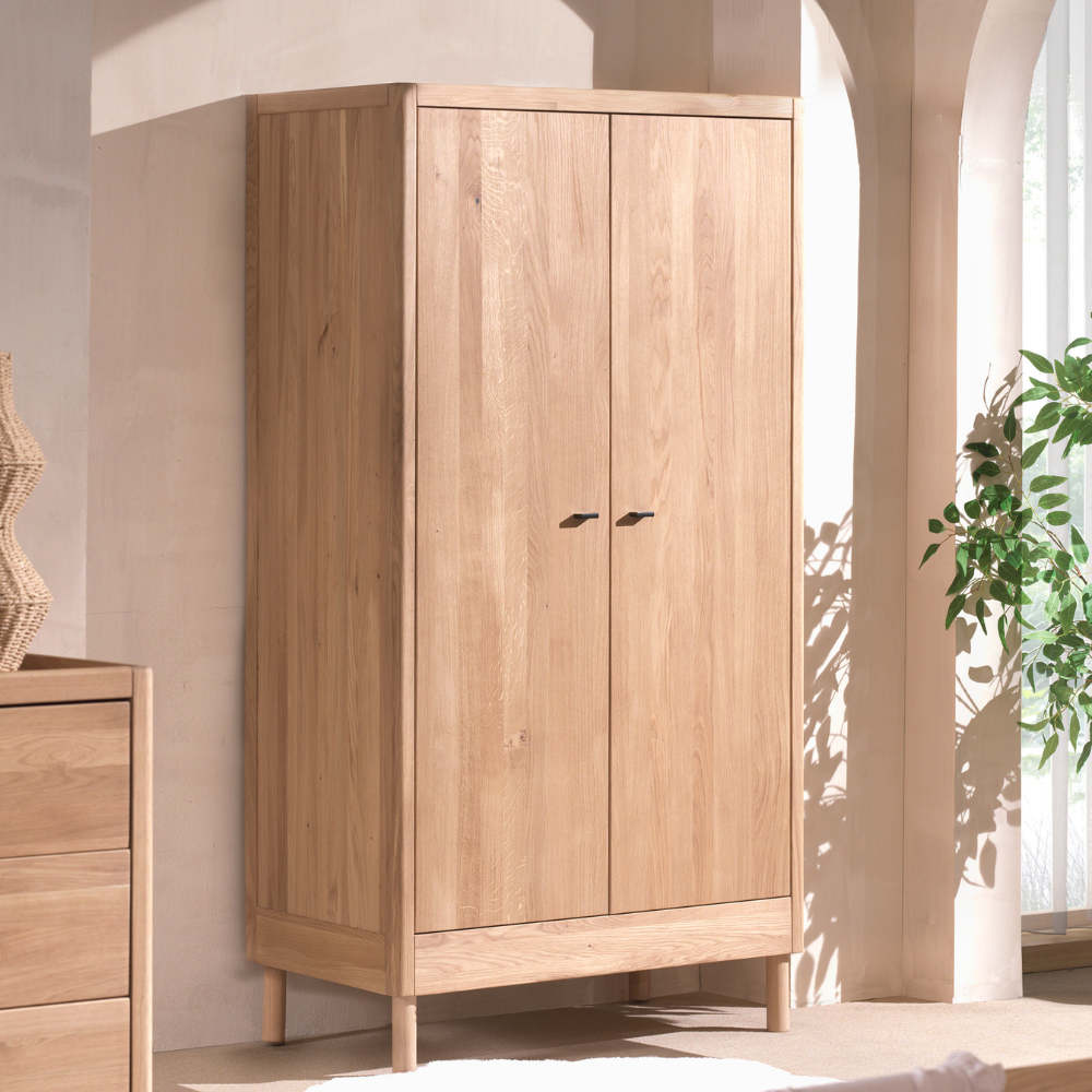 The Forrest Kids 2 Door Wardrobe in Oak features 3 spacious shelves and a hanging rail, soft close on the doors and a natural lacquered finish