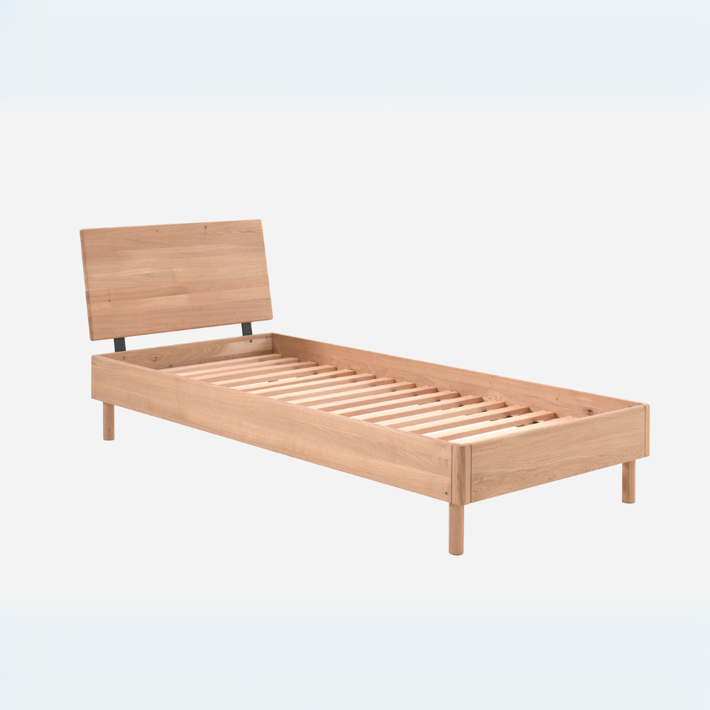 The Forrest Kids Bed 90 x 200cm in Oak offers a natural finish, an oak headboard with a sturdy frame & a slat base included, perfect for kids aged 4+