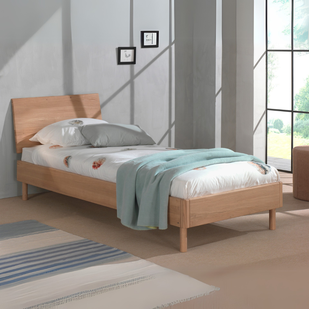 The Forrest Kids Bed 90 x 200cm in Oak offers a natural finish, an oak headboard with a sturdy frame & a slat base included, perfect for kids aged 4+