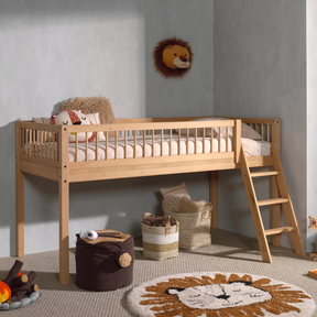 The Forrest Kids Mid Sleeper Bed in Oak features an under bed play/storage space, a side ladder and a natural lacquered finish in a rustic style