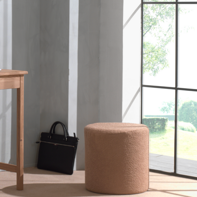 The Forrest Kids Pouf in Brown features multifunctional design use as a seat, footstool or nightstand, in warm brown soft bouclé perfect for modern rooms