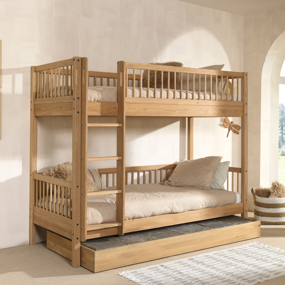 The Forrest Oak Kids Bunk Bed with Drawer provides strong oak material while providing ample storage space and ladder that can be positioned on either side