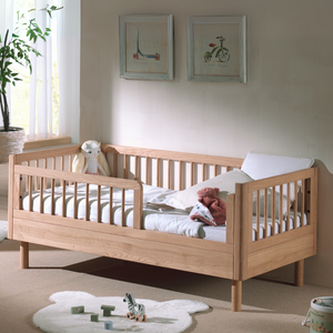 The Forrest Toddler Bed 70 x 140cm in Oak features raised sides for fall protection and solid European oak, ideal for transitioning from a crib