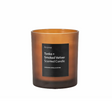 The Gallery Aroma Tonka & Smoked Vetiver Candle in amber glass, 45-hour burn, earthy tonka & vetiver scent for a cozy ambiance.