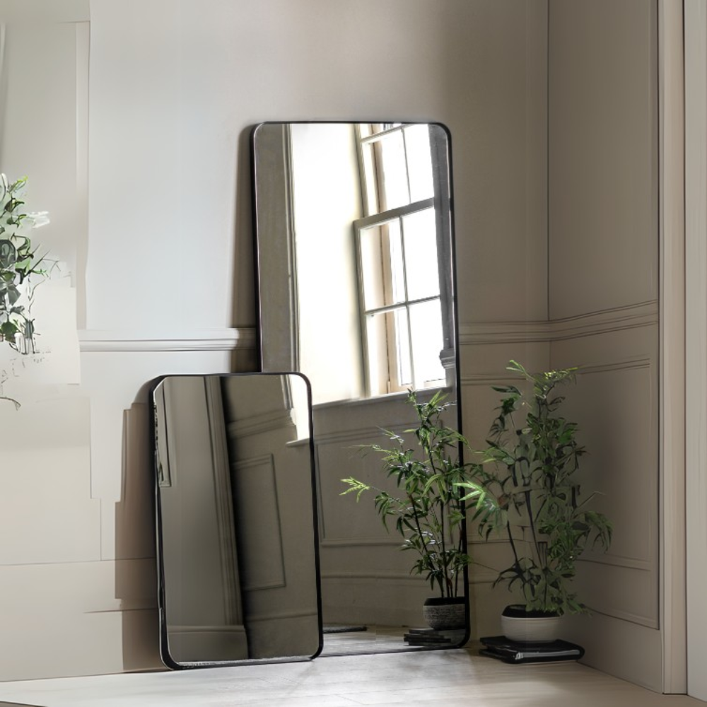 The Gallery Holworth Leaner Mirror in Black offers a sleek frame and full-length design, perfect for any modern or classic space.