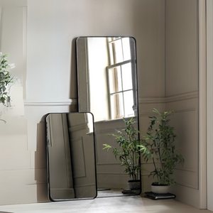 The Gallery Holworth Leaner Mirror in Black offers a sleek frame and full-length design, perfect for any modern or classic space.