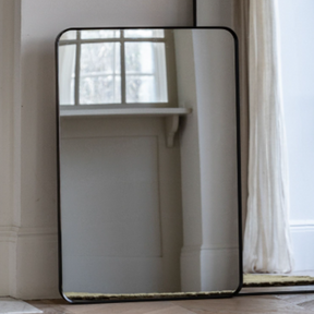 The Gallery Holworth Rectangle Mirror in Black features a sleek black frame, rectangular design and versatile style