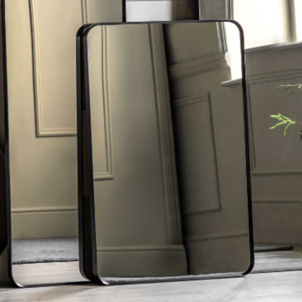 The Gallery Holworth Rectangle Mirror in Black features a sleek black frame, rectangular design and versatile style