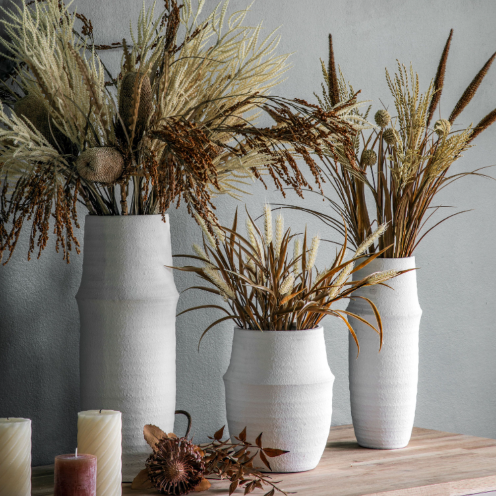 The Gallery Larson Medium Vase in White offers a matte finish, ideal for displaying flowers or an accent piece.