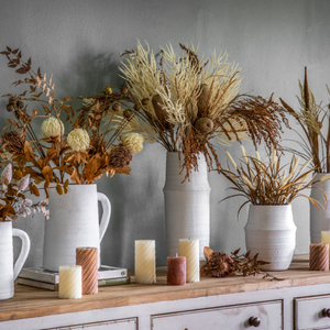 The Gallery Larson Medium Vase in White offers a matte finish, ideal for displaying flowers or an accent piece.