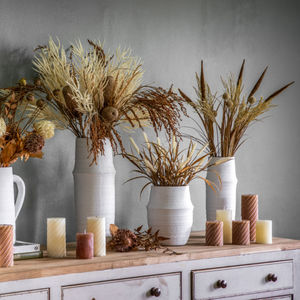 The Gallery Larson Small Vase in White made from terracotta offers a matte finish, ideal for displaying flowers or an accent piece.