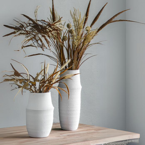 The Gallery Larson Small Vase in White made from terracotta offers a matte finish, ideal for displaying flowers or an accent piece.