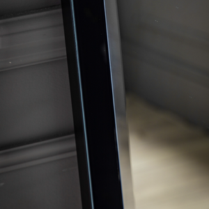The Gallery Luna Large Mirror in Black features bevelled glass, angled frame, large versatile hanging or leaning options