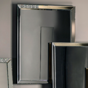 The Gallery Luna Overmantle Mirror in Silver features bevelled panels, sleek silver edge and versatile hanging options.
