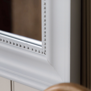 The Gallery Sherwood Large Rectangle Mirror in Stone adds light and depth with its classic frame and durable design.