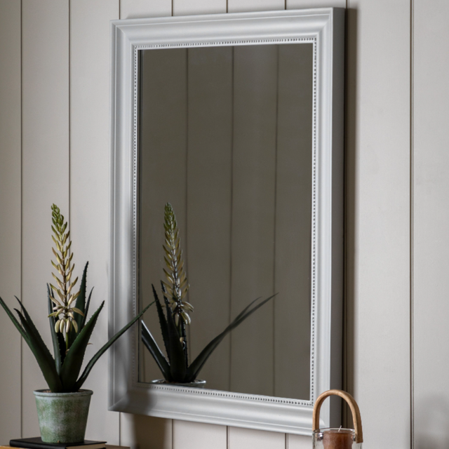 The Gallery Sherwood Large Rectangle Mirror in Stone adds light and depth with its classic frame and durable design.