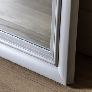 The Gallery Sherwood Window Mirror in Stone features a windowpane design, stone finish and durable build