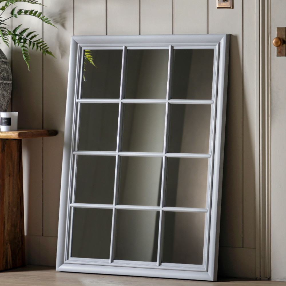 The Gallery Sherwood Window Mirror in Stone features a windowpane design, stone finish and durable build