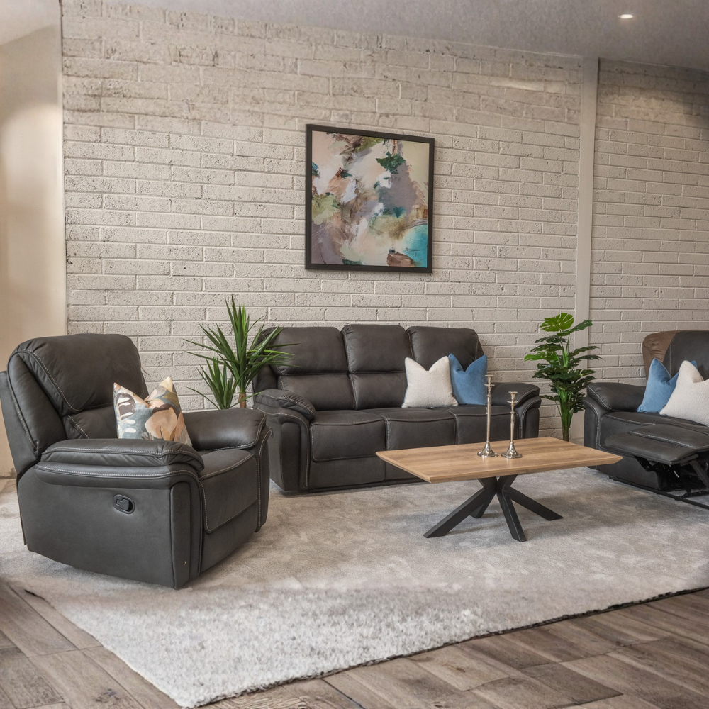 The Glendale Recliner Sofa in Slate Navy features a stylish recliner offering plush comfort, smooth recline and a touch of modern elegance for any home