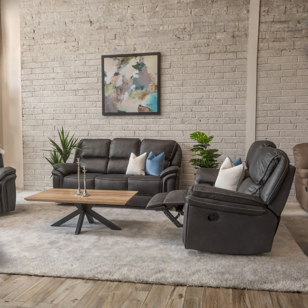 The Glendale Recliner Sofa in Slate Navy features a stylish recliner offering plush comfort, smooth recline and a touch of modern elegance for any home