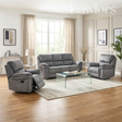A dark grey upholstered living room furniture set including a 3+1+1 sofa set, a glass-top coffee table, and a light rug, staged in a bright modern living room with wood floors and beige curtains.