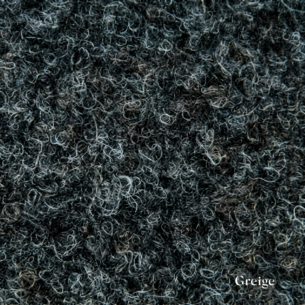 Close-up of a textured gray fabric surface with 'Greige' label.