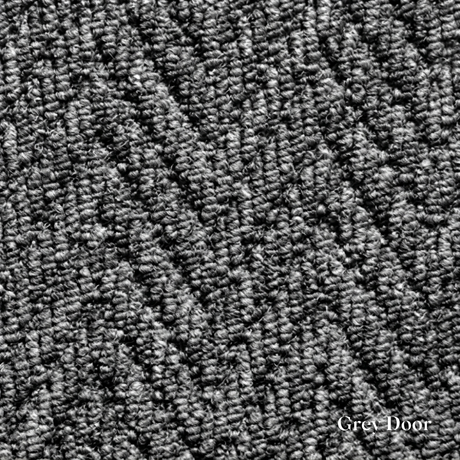Close-up of textured grey carpet with 'Grey Door' branding.