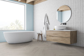 Discover Greywood Herringbone Vinly & SPC flooring: 4mm thick, waterproof, 20-year guarantee, compatible with underfloor heating.
