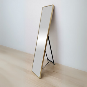 The Hamal Dressing Mirror (150.5x30.5cm) has a full-length design, a slim gold aluminium frame, and wall-mount or freestanding options.