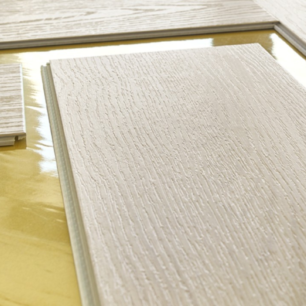 The Harlow Oak Herringbone SPC Flooring features a timeless oak design, suitable for underfloor heating, Titanium Nano finish and a 25 year warranty