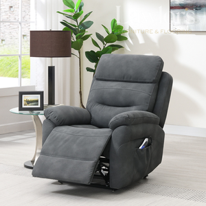 Dark Grey life & rise recliner chair in a living room setting with a lamp, plant, and framed picture.