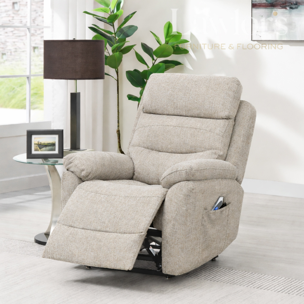 Oatmeal lift & rise recliner armchair in a living room setting with a lamp, plant, and framed picture.