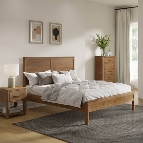 Wooden bed in a bedroom with nightstands, lamp, and chest of drawers.