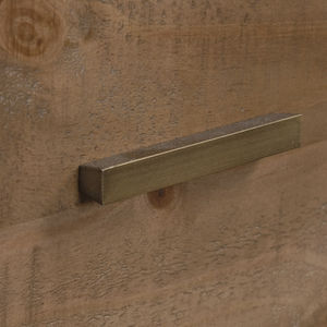 Brass handle on a wooden surface