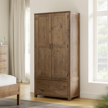 Wooden wardrobe in a room with a bed and window