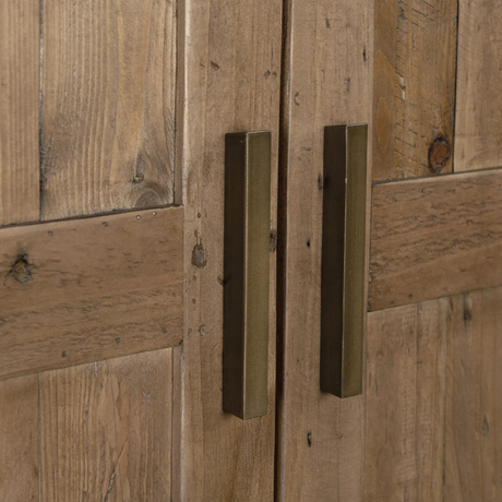 Close-up of a wooden door with brass handles