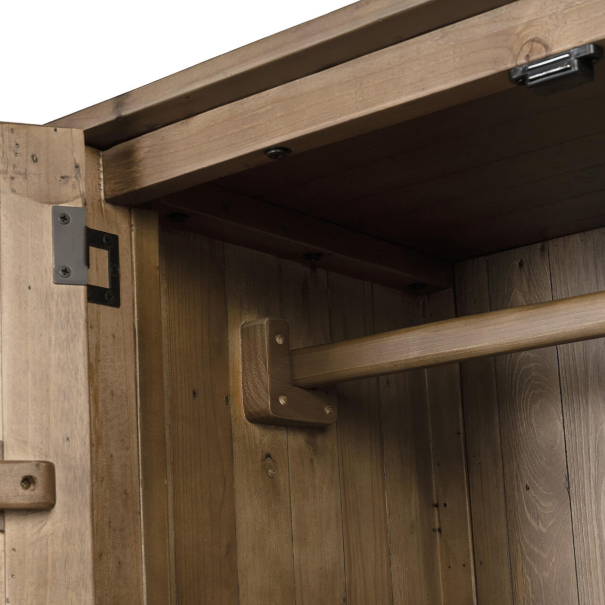 Close-up of a wooden wardrobe with metal brackets and hinges.