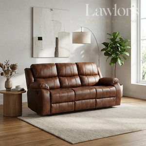 A tan PU leather 3 seater reclining sofa in a modern living room setting with a wooden floor, beige rug, side table, floor lamp, and potted plant.