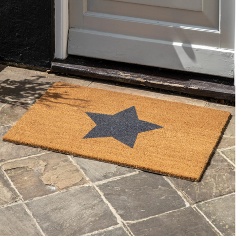 The Jumbo Star Coir Doormat features chic grey star design, durable coir fibers for efficient dirt removal and generous