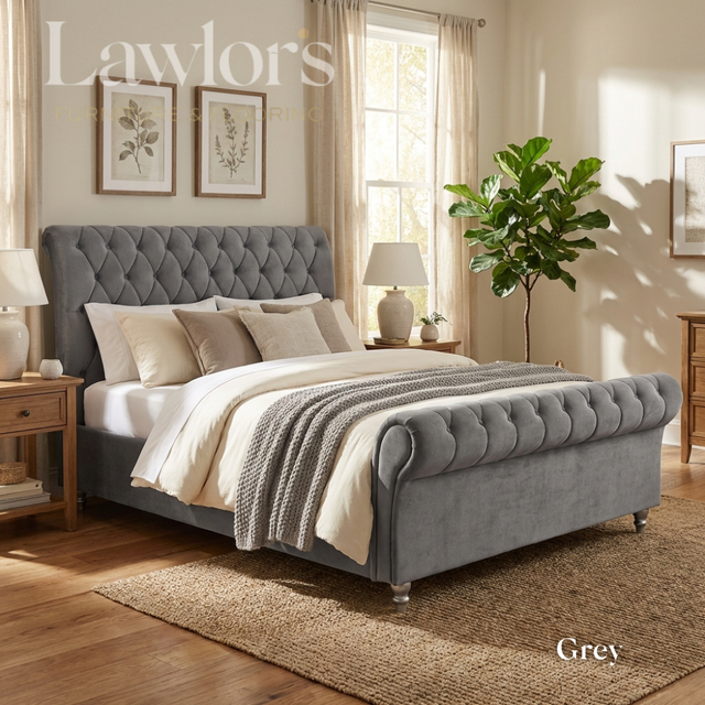 Grey upholstered bed and mattress in a well-lit bedroom bed pack