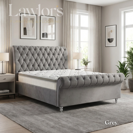 Grey upholstered bedframe and mattress in a well-lit bedroom bed pack
