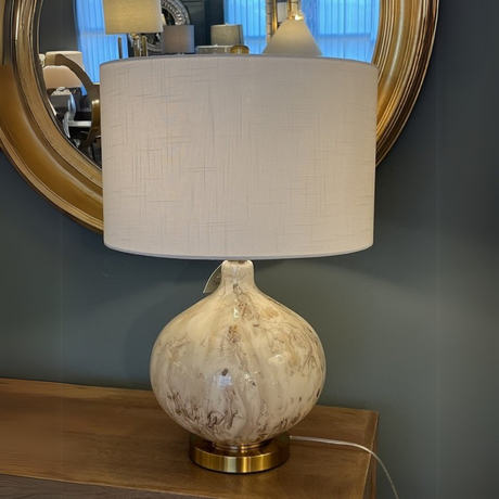 The Koma Table Lamp (64cm) offers warm ambient lighting and contemporary elegance with its sleek glass and metal base and straight round white shade.