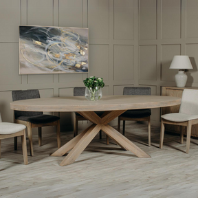 The Foxford Large Oval Dining Table in Smoked Oak is crafted with stylish smoked oak veneer and supported by solid oak legs