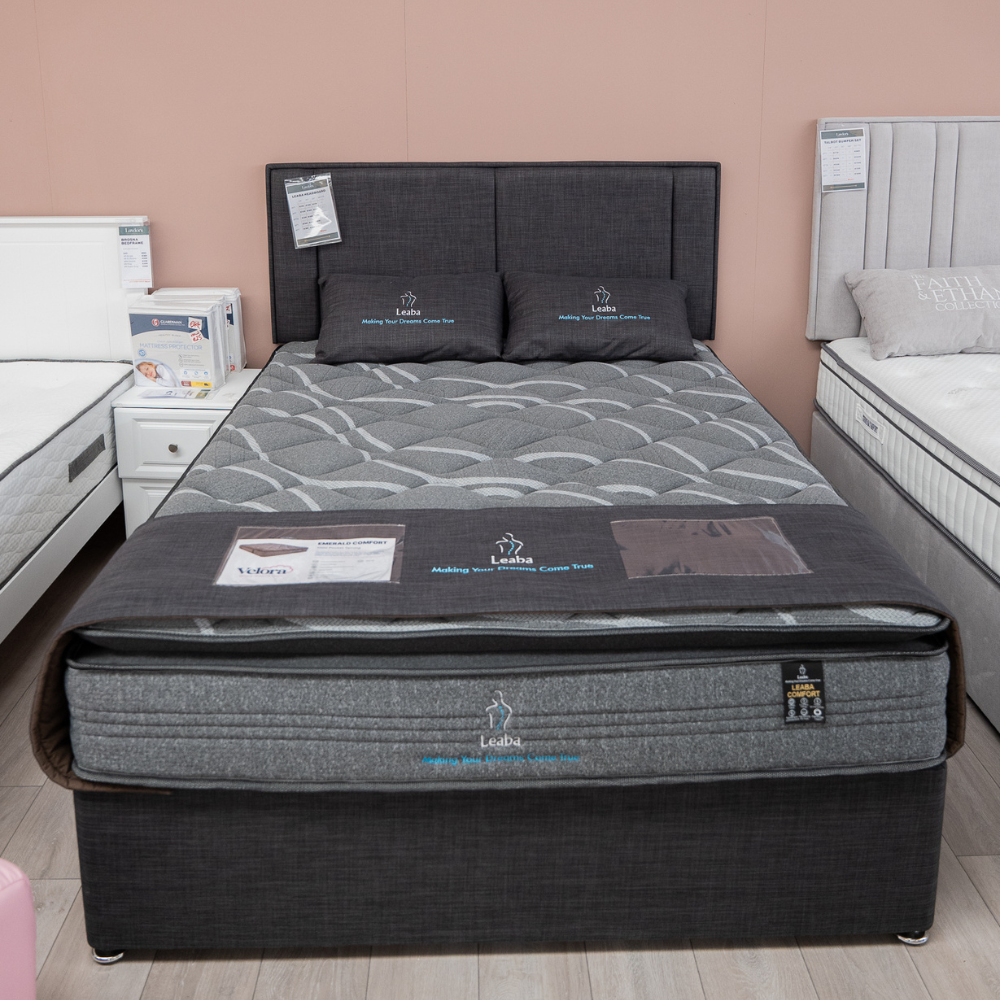 The Leaba Divan Base in Charcoal features a reinforced frame, chrome gliders and stylish fabric for lasting comfort and sleek bedroom appeal
