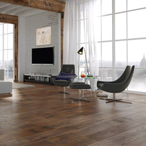 The Leonardo Oak Laminate Flooring - 12mm offers AC5 durability, natural wood texture, and a 30-year warranty.