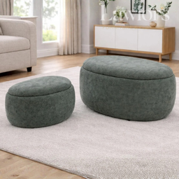 Two green ottomans in a living room setting with a couch and cabinet in the background.