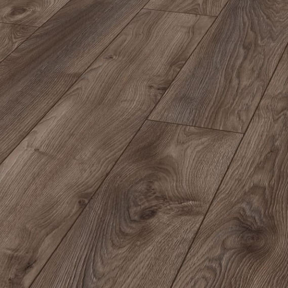 The Macro Oak Brown Laminate Flooring 12mm with AC5 rating, long planks for a stylish look and5G click install, compatible with underfloor heating.