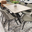 The Malin Grey Dining Set includes the Malin Fixed Dining Table and 6 Tan Miro Dining Chairs