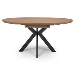 The Malin Extending Round Table 1200-1600mm in Light Walnut features heat, stain, and scratch resistance