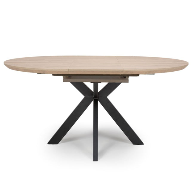 The Malin Extendable Round Dining Table in Oak offers a wood-effect top ensuring heat, stain & scratch resistance